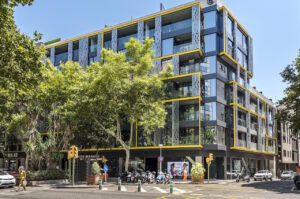 a building with trees and a parking lot